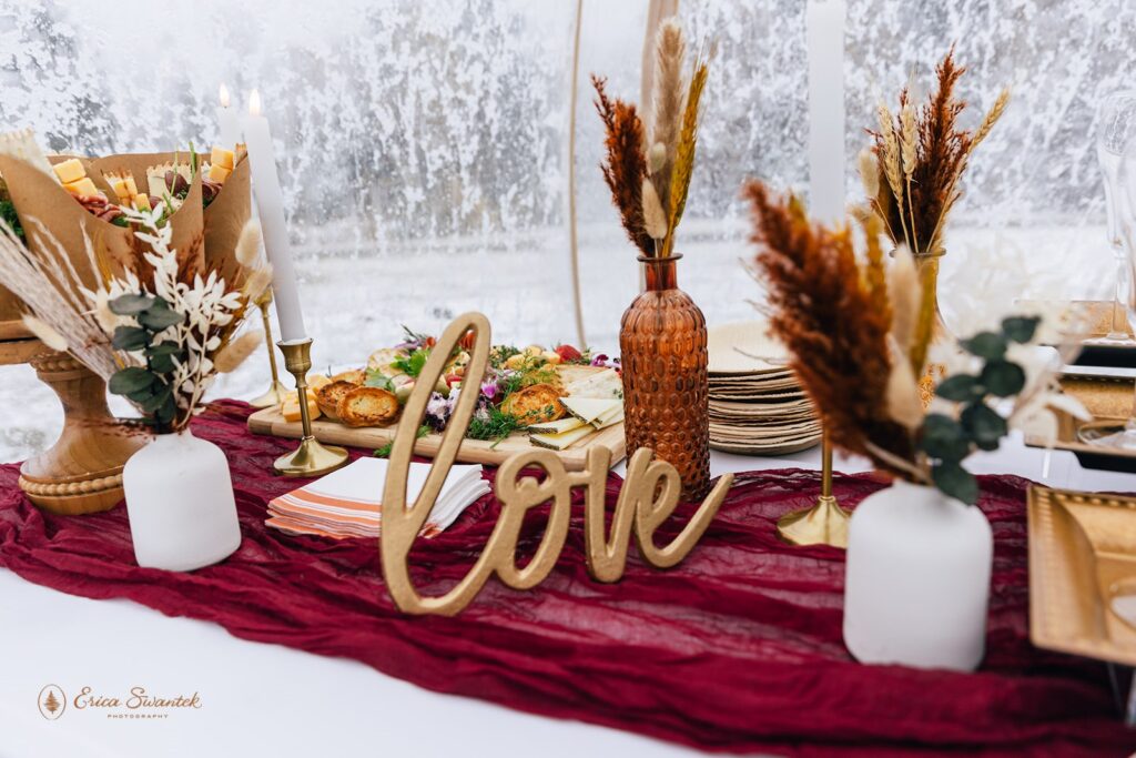 elopement picnic charcuterie set up on a boho styled table setting