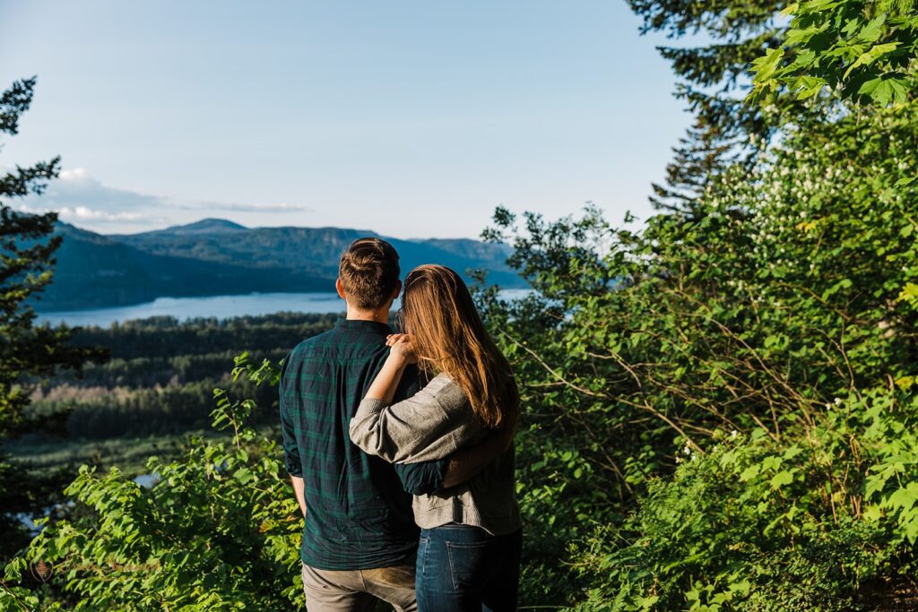 A couple gazing upon the beautiful Columbia River Gorge scenery