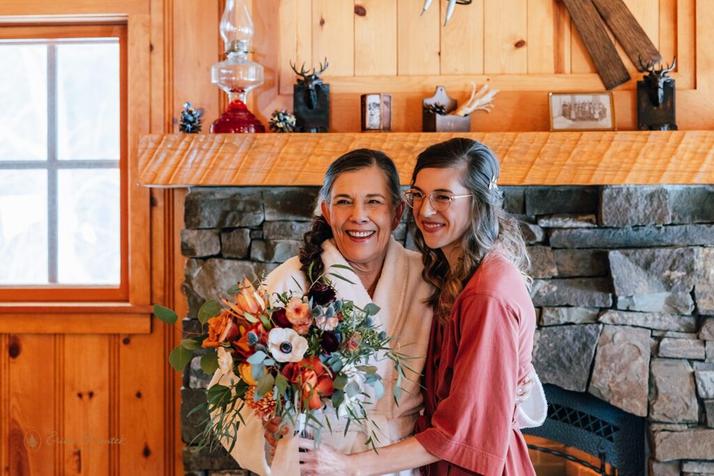 mom delivering a colorful bridal bouquet to her daughter, the bride