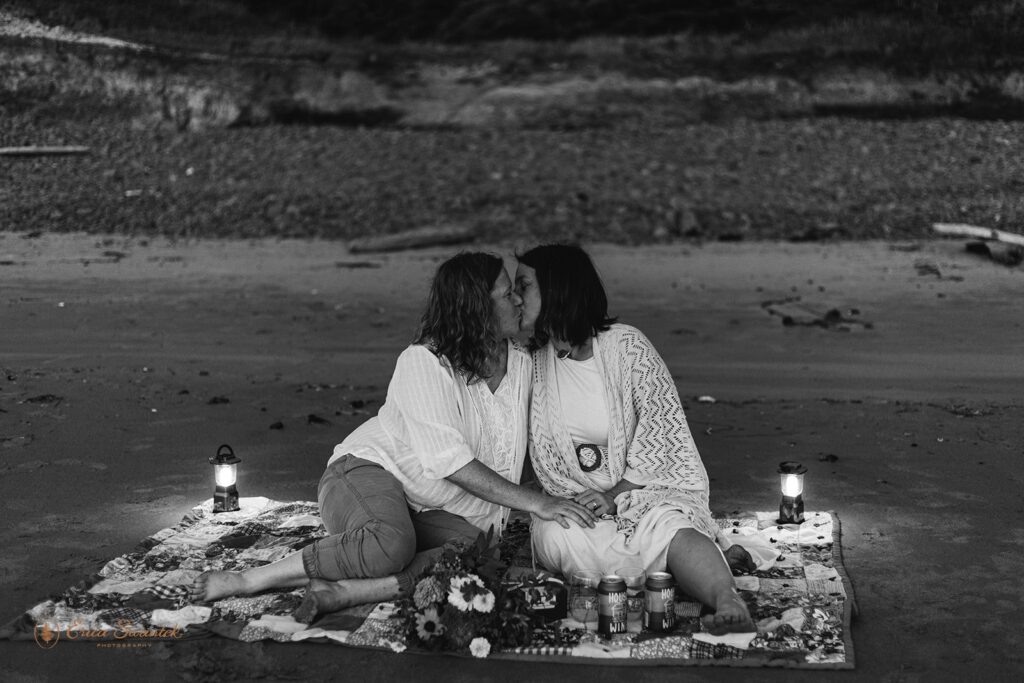 lgbtq+ elopement couple enjoying a picnic at the beach