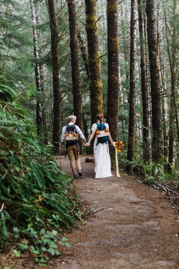 an adventure elopement couple hiking through a forest during their PNW elopement day