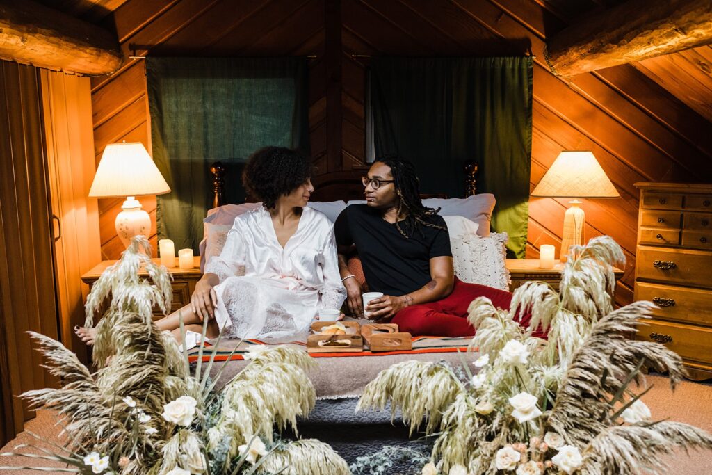 romantic elopement couple cozy on the bed in their airbnb