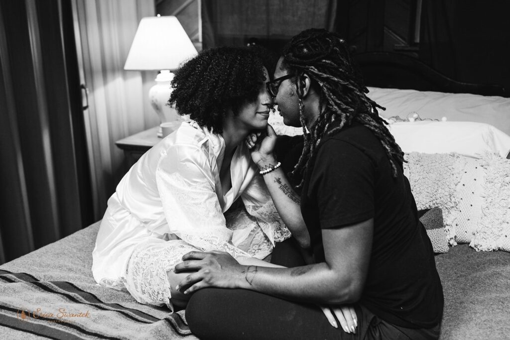 romantic elopement couple cozy on the bed in their airbnb