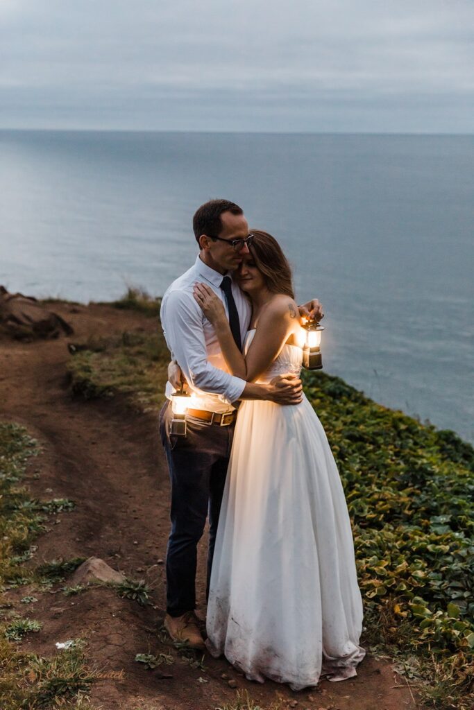 a beautiful elopement couple during their nighttime session with lanterns