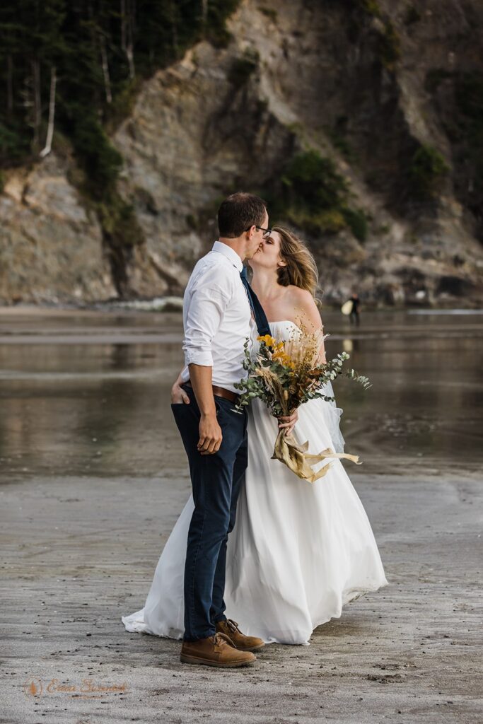 playful elopement couple during their all day beach elopement in Oregon