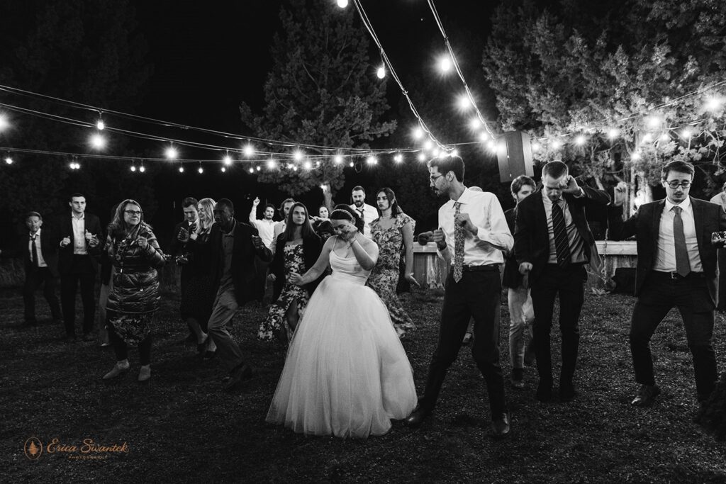 fun outdoor elopement reception, guests dancing and having a blast with the couple