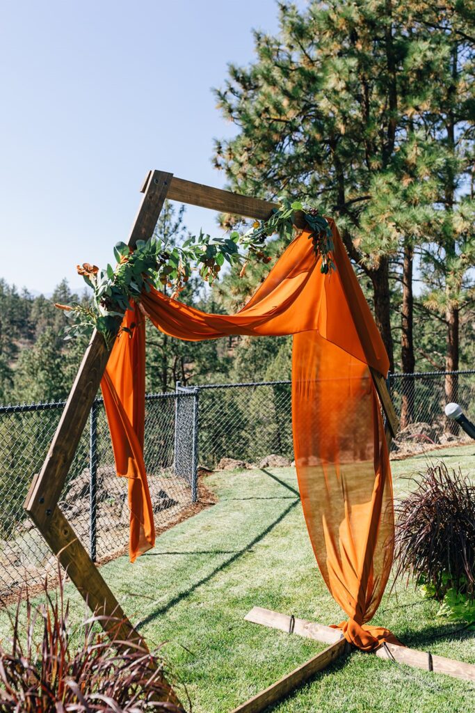 a boho wedding arch outdoors