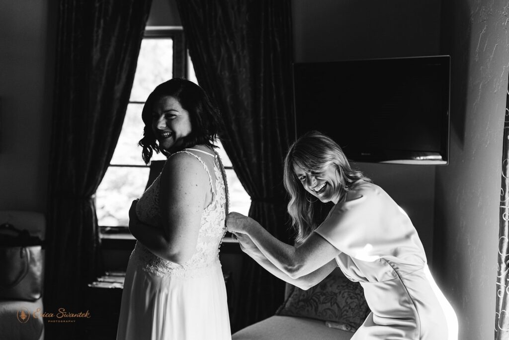 bride getting ready with her friend