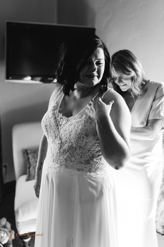 bride getting ready with her friend