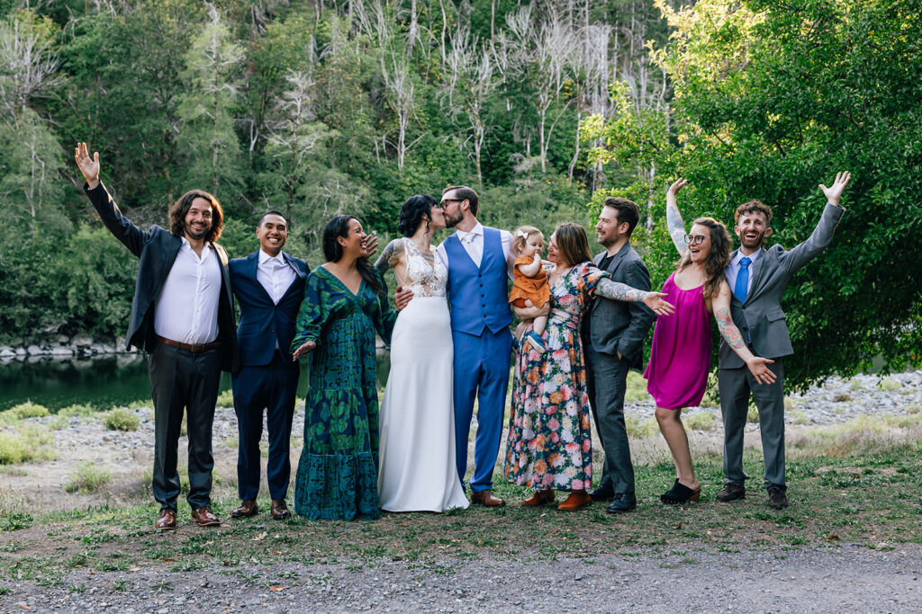 Wedding guests celebrate with the couple at their Oregon wedding. 