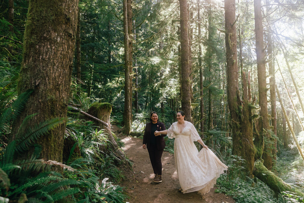 A lesbian couple shares a dance in the forest of their Oregon elopement.