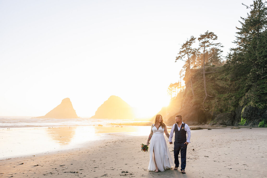 Sunset above Heceta Lighthouse on the Oregon Coast with a couple eloping.