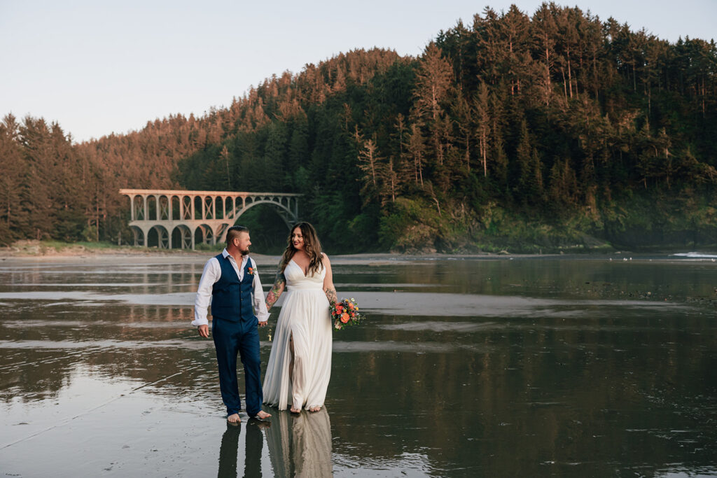 A couple elopes at Cape Cove Beach near Heceta Lighthouse on the Oregon Coast.