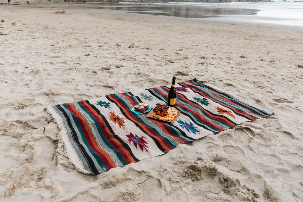 A picnic on the beach in Oregon for an elopement celebration.