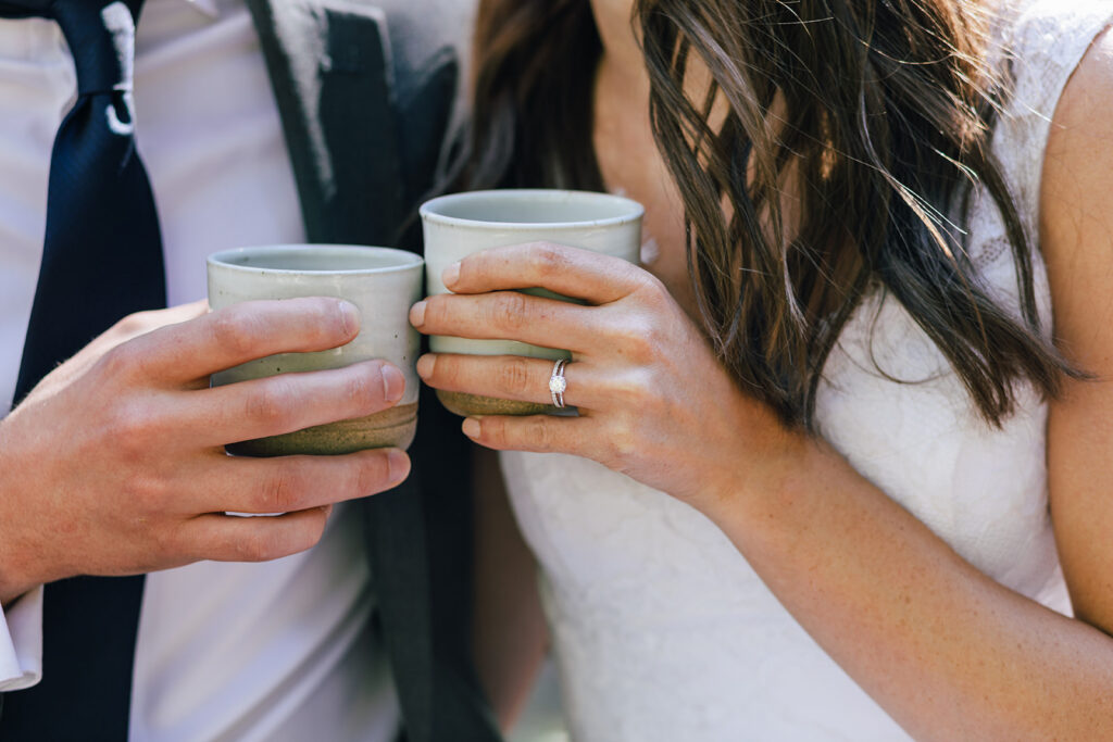A bride and groom share a coffee break during their full day elopement in Washington. 