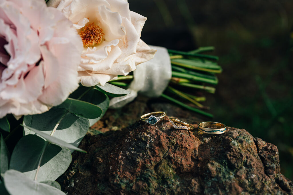 wedding rings on a rock