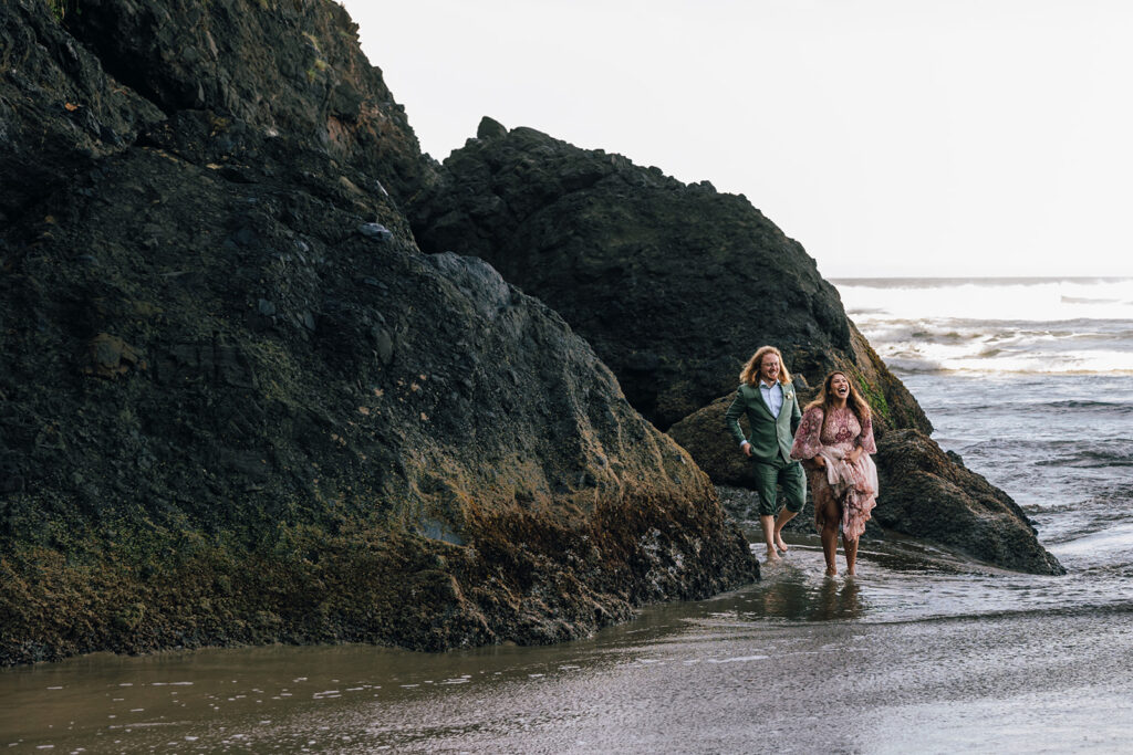 Waves crash on an Oregon wedding couple. 