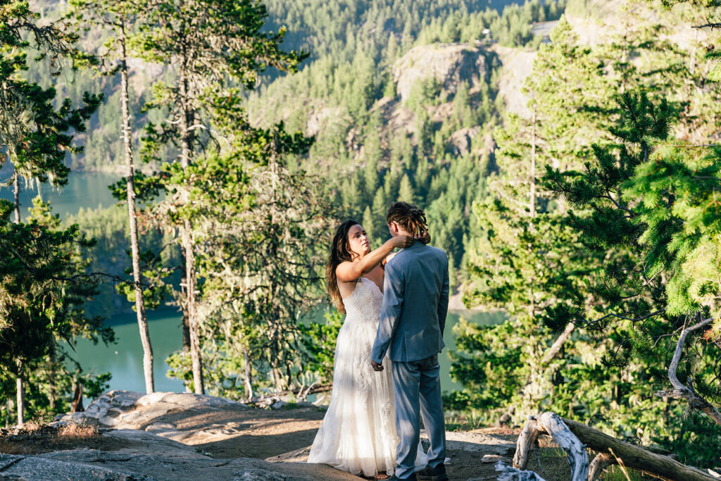 Bride straightens grooms tie before their North Cascades elopement ceremony.
