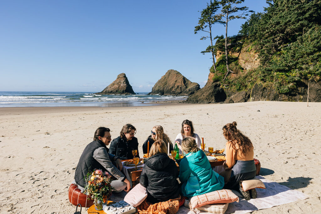 Luxury picnic on the beach during an intimate elopement on the Oregon Coast.