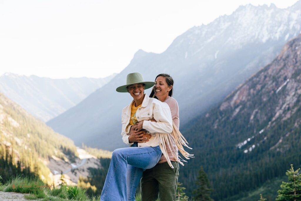 mountain adventure engagement photos with fun western outfits for the couple