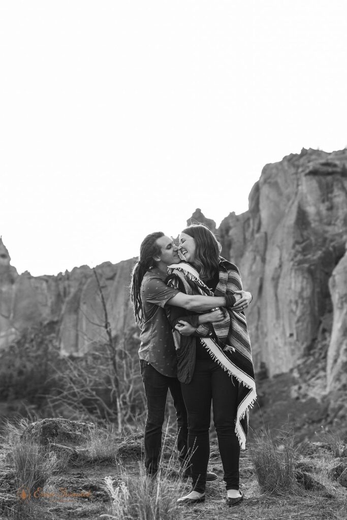 sweet engaged couple kissing during their PNW adventure engagement photos