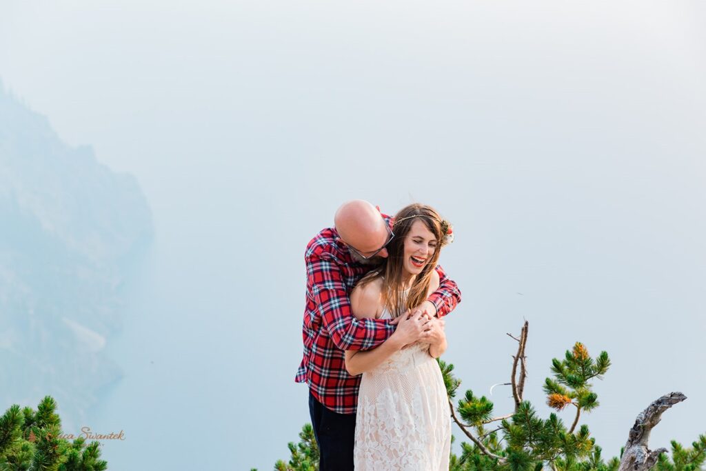 Newly weds being all cute and cuddly for their Crater Park Elopement with beautiful foggy backdrop