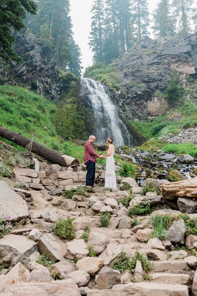 intimate elopement ceremony in Crater Lake with beautiful waterfall backdrops