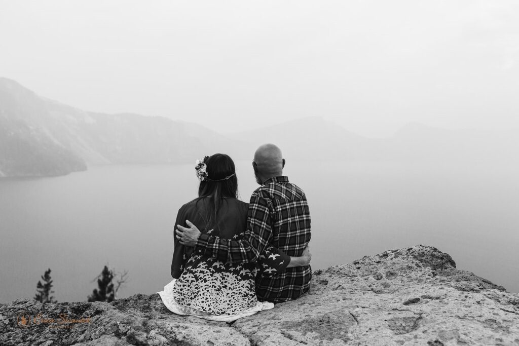 Newlyweds enjoy the magnificent sunset after their Crater Lake elopement in Oregon. | Erica Swantek Photography