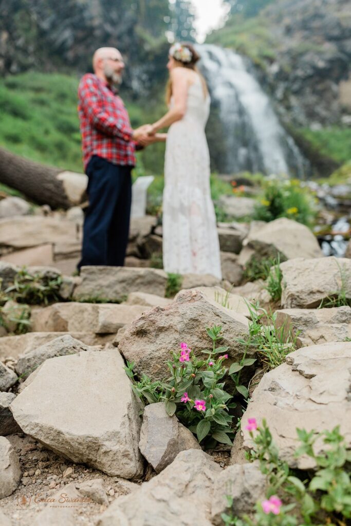 intimate elopement ceremony in Crater Lake with beautiful waterfall backdrops