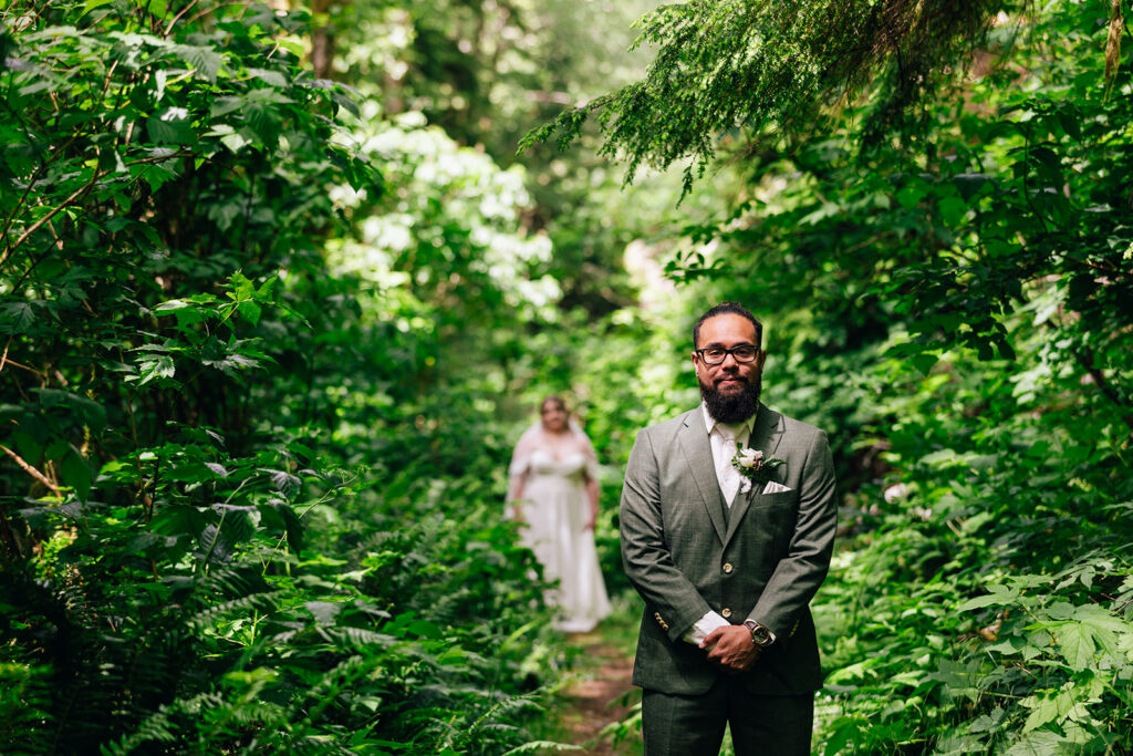 groom seeing his bride for their first look on their elopement day in Oregon