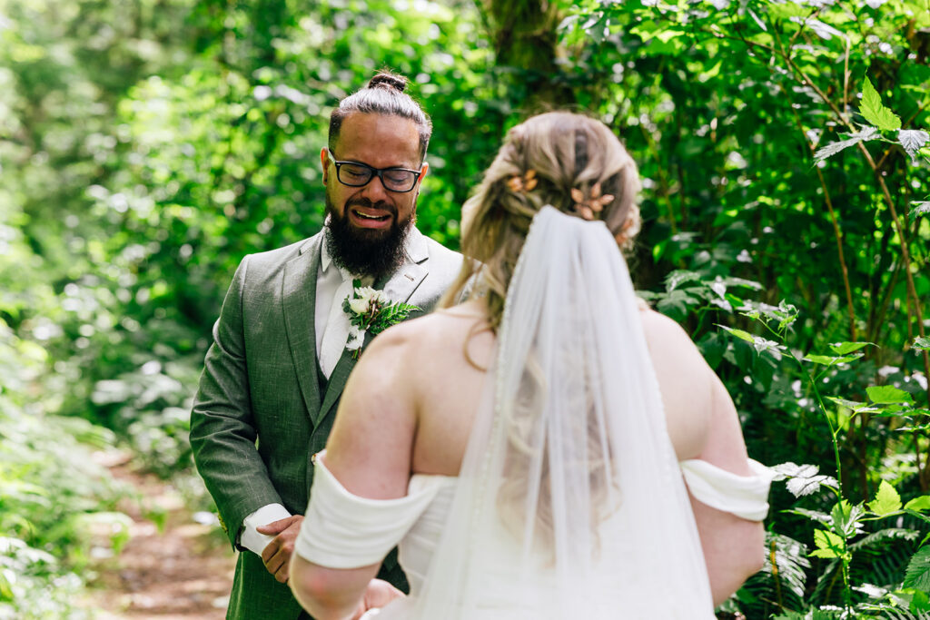 groom seeing his bride for their first look on their elopement day in Oregon