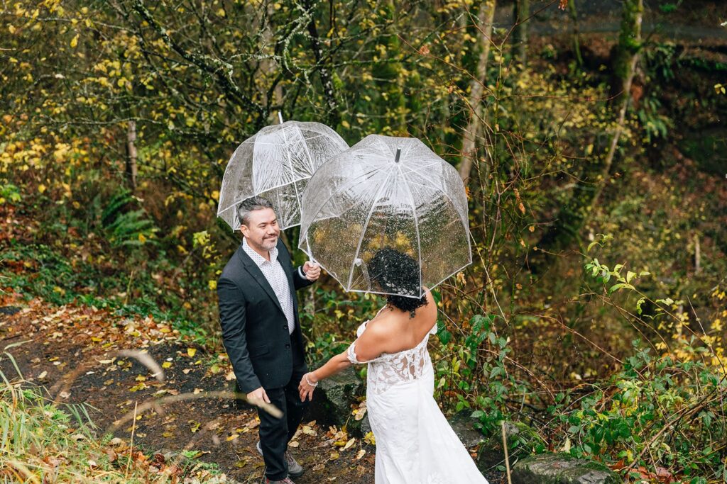 bride and groom rainy first look