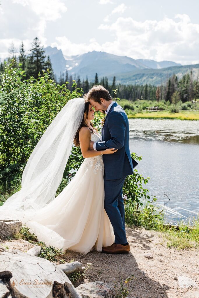 candid and playful elopement couple with wind messing with their attire and hair