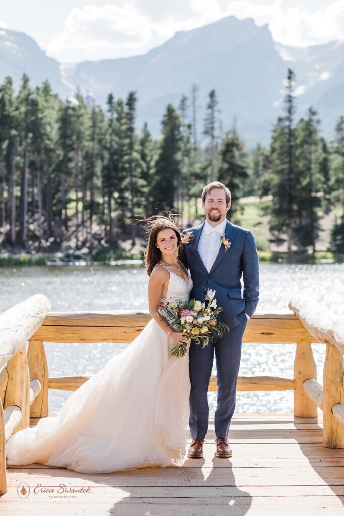 candid and playful elopement couple with wind messing with their attire and hair