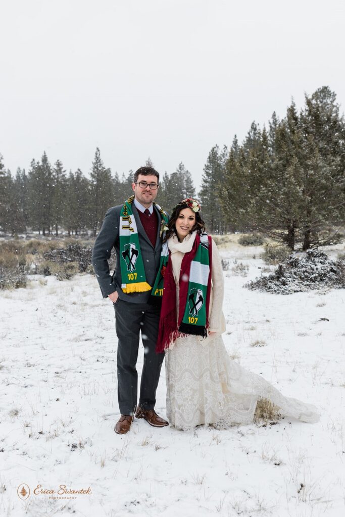 newly weds in a snowy forest for their PNW winter elopement