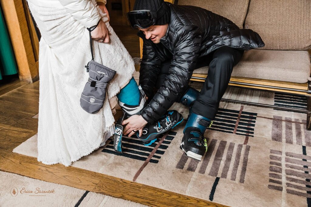 bride and groom sitting in their airbnb in their skiing attire ready for winter adventures