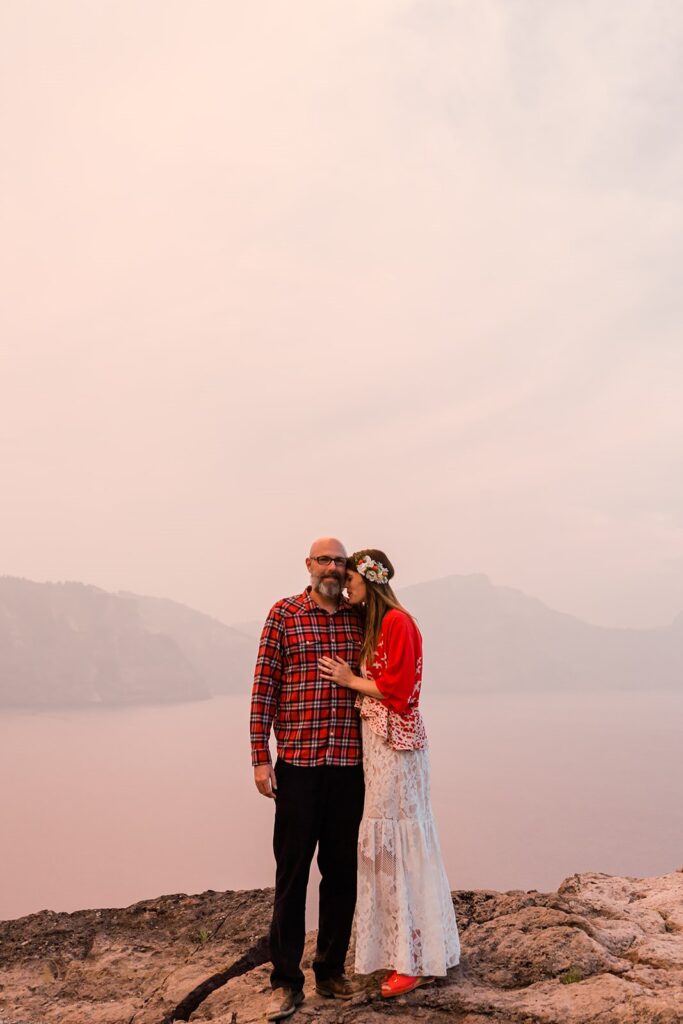 smoky elopement portraits in Crater Lake during the fire season