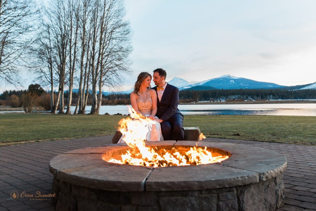 a dreamy Oregon winter elopement at Black Butte Ranch, couple sitting by a fireplace