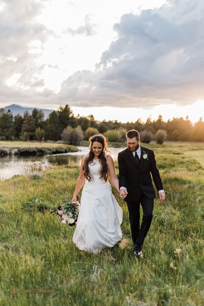 an elegant wedding couple in a lush field during their Black Butte Ranch wedding