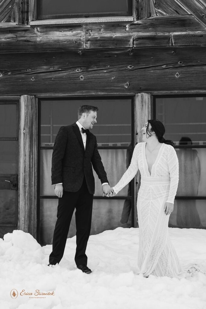 a cozy winter elopement with the couple surrounded by snow