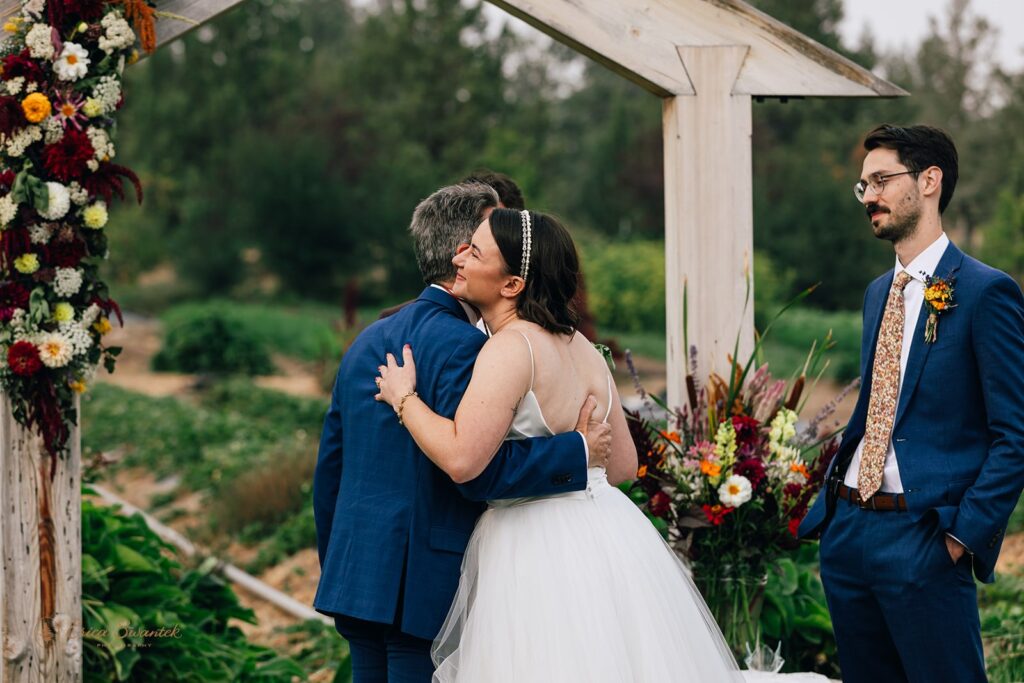 dad giving the bride away at the altar