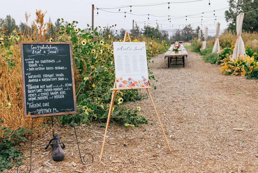 Rainshadow Organics farm outdoor wedding reception set up, with a closer look of the menu