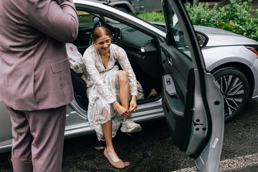 bride putting on her hiking boots preparing for the adventure elopement in ONP