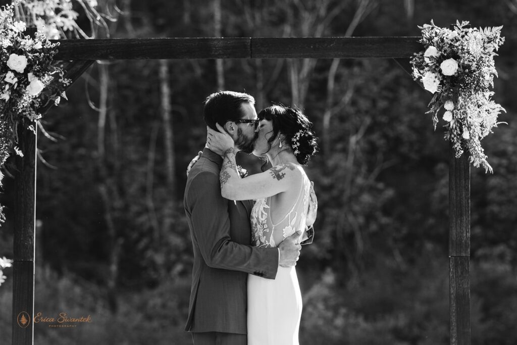 bride and groom first kiss