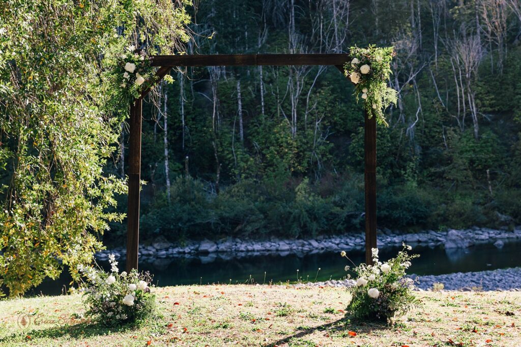 rustic elopement ceremony arch at chetco river shores