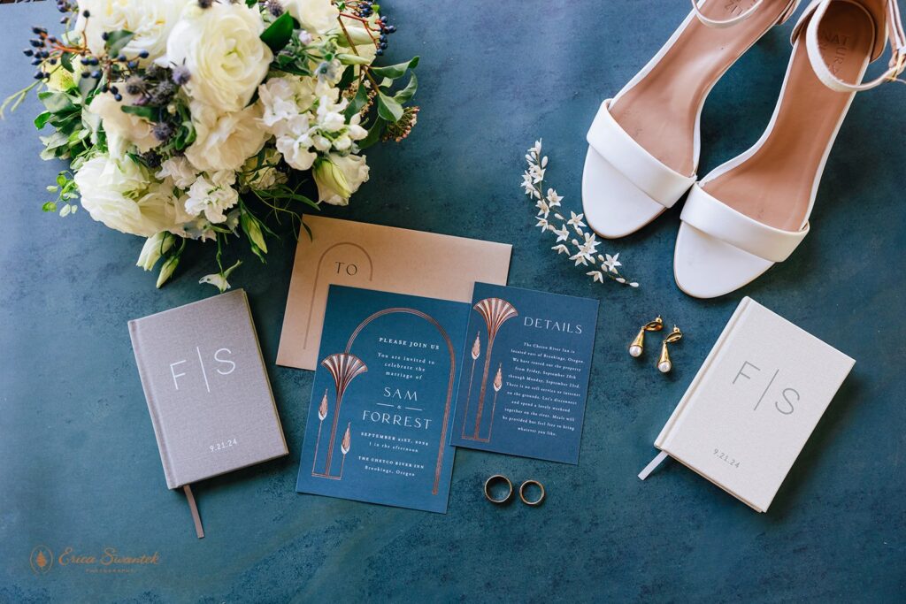 elopement detail flatlay of stationery, bouquet and bride's white wedding shoes