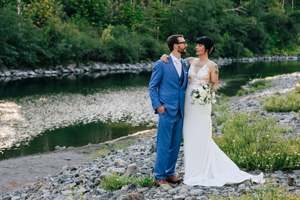 bride and groom at the shores of chetco river