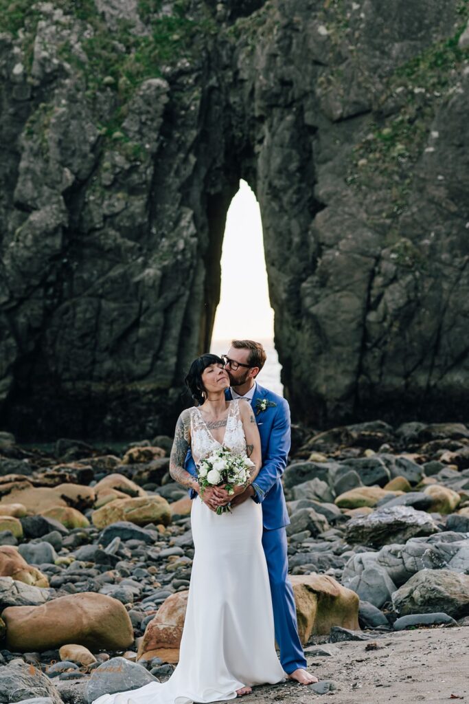 intimate bride and groom moment during their harris beach elopement portraits