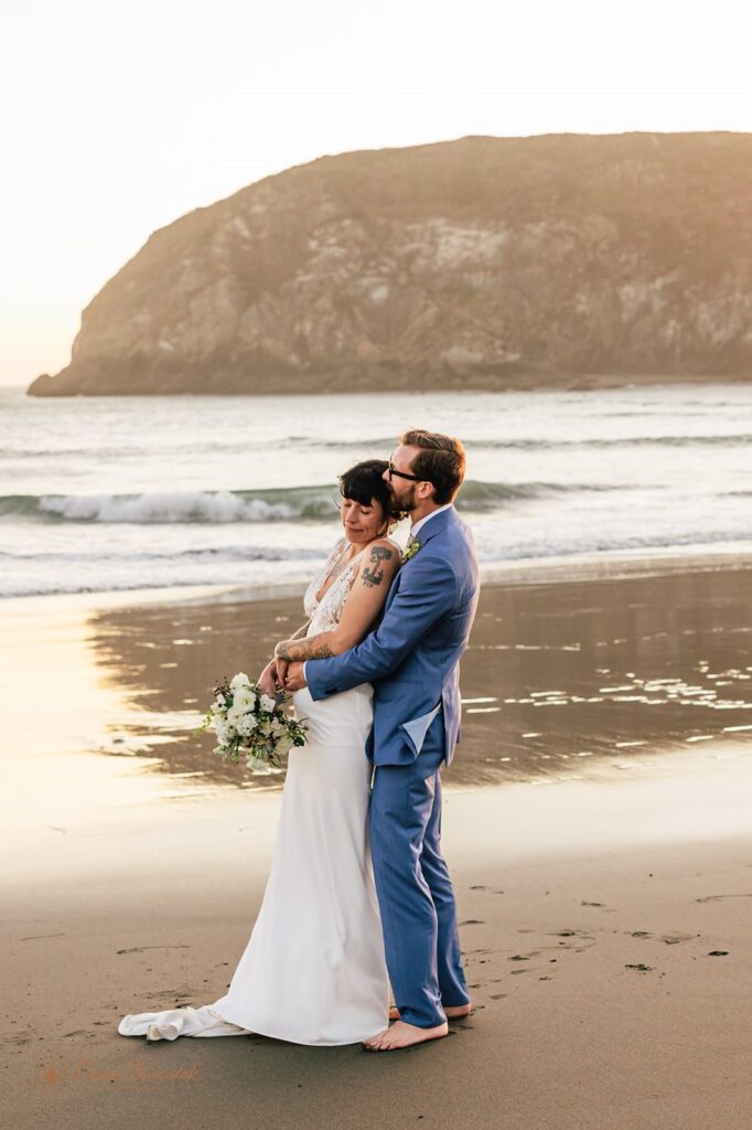 intimate bride and groom moment during their harris beach elopement portraits