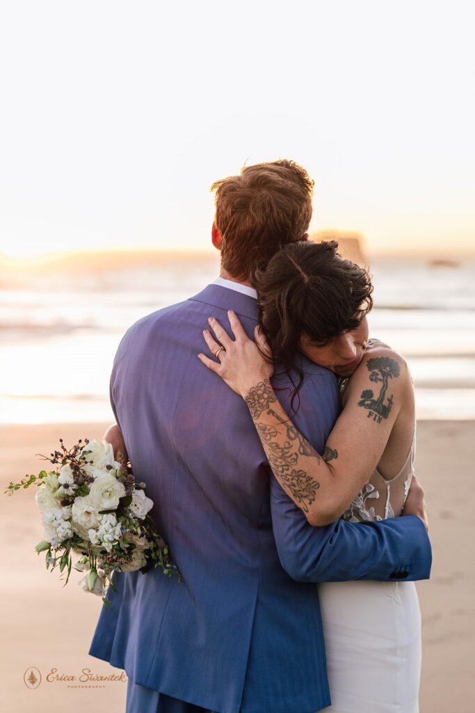 intimate moment of bride and groom hugging